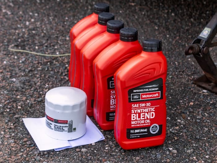 Engine oil containers and an oil filter