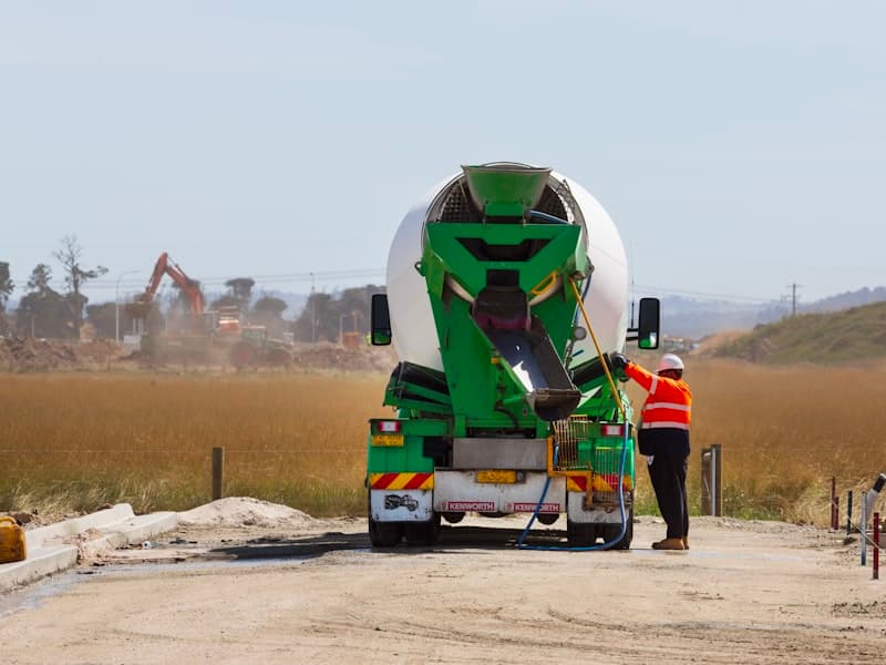 Concrete mixer truck discharging on site
