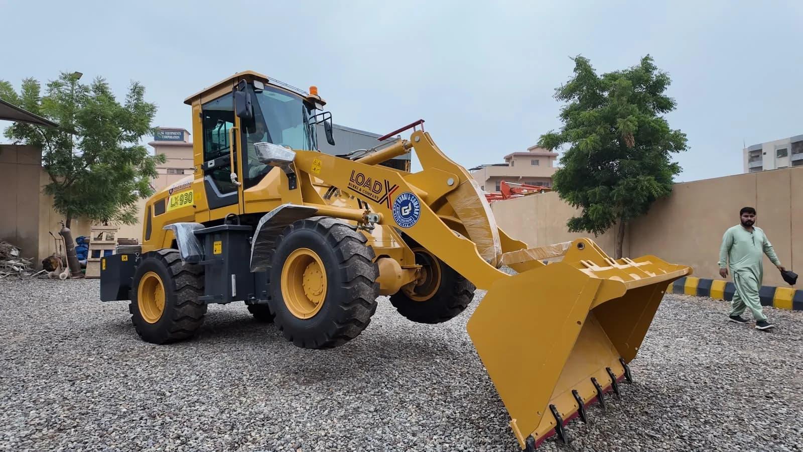 LOAD-X LX-930 wheel loader, front three-quarter view with the bucket down