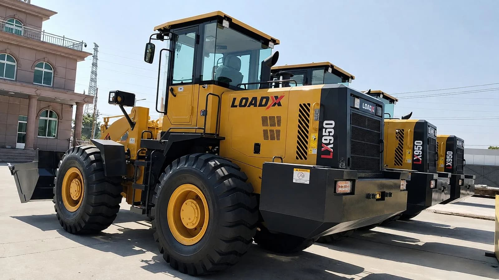 LOAD-X LX-950 wheel loader, three-quarter view, carrying its LX950 badge